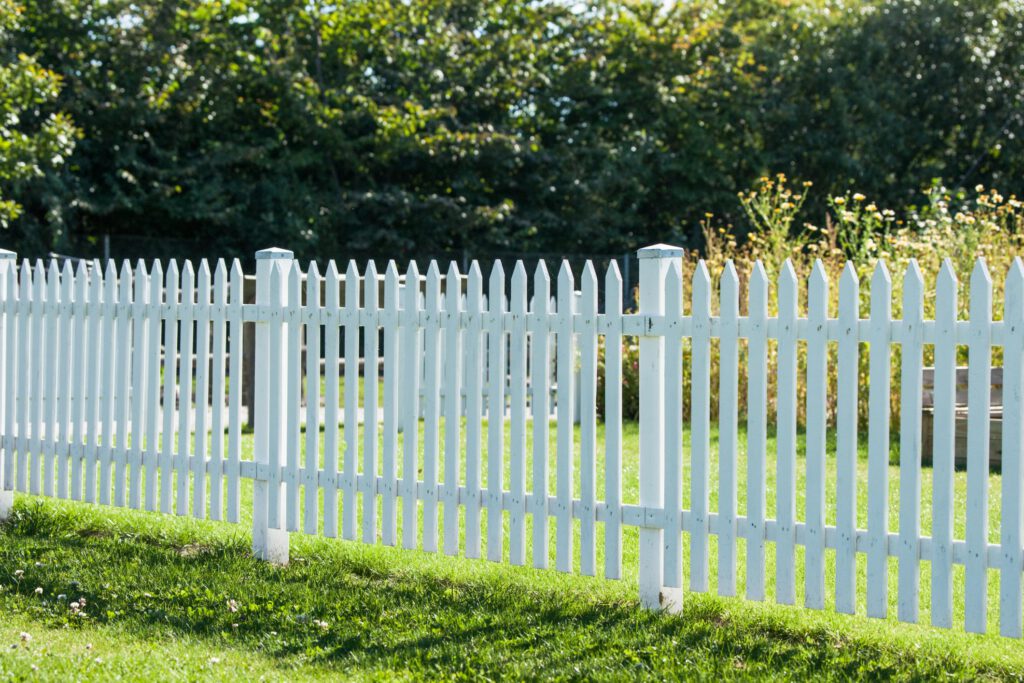 white vinyl fence in the yard